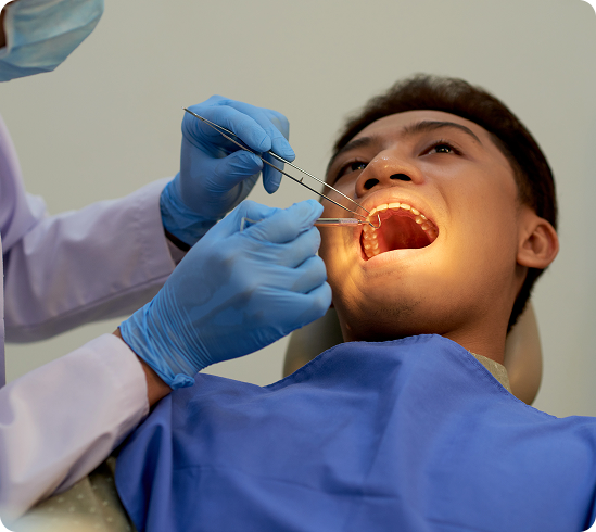 young-man-sitting-mouth-wide-open-office-dentist-annual-examination 1 (1)